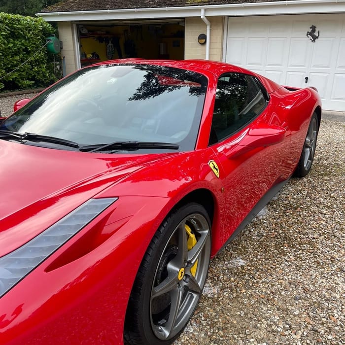 Ferrari 458 after ByBrasso exterior clean — gleaming red paintwork