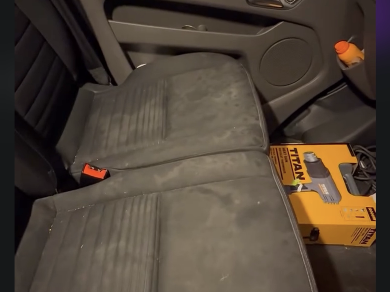 Car rear seats before treatment — heavily stained and grimy upholstery